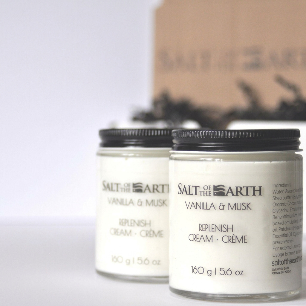 Two 160 g Salt of the Earth Vanilla & Musk Replenish Cream jars with black lids and kraft gift packaging.
